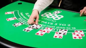 Evolution Gaming live blackjack table broadcast with dealer and cards visible on mobile screen